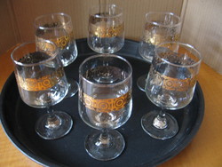 Set of retro gilded cognac and wine glasses