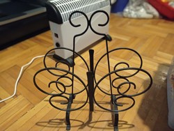 Wrought iron newspaper holder in the shape of a butterfly