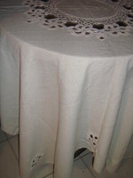 A huge festive tablecloth in cream color with a fabulous hand-crocheted flower insert