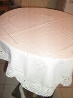 Beautiful elegant hand-embroidered azure ecru tablecloth with hand-crocheted edges