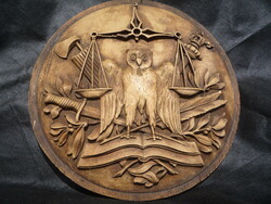 Old carved coat of arms.