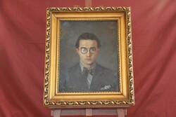 István Nagy with sign - male portrait