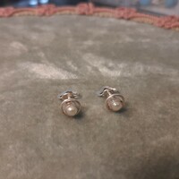A pair of silver beaded coil earrings