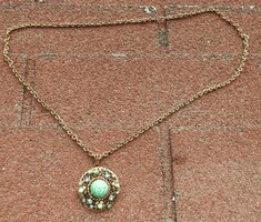 Old necklace with green stones and gold color