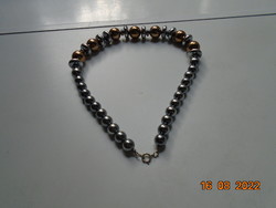 Necklace made of gold-plated and silver-plated larger pearls