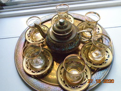 Handmade copper pourer and tray with golden tones, gold-striped Jena glass with glasses, coffee set