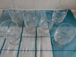 A set of engraved glass drinking glasses with a polished base, made in the 1970s