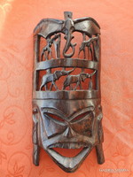 African hand carved wooden wall mask decorated with elephants and giraffes