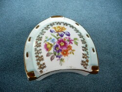 Horseshoe-shaped German jewelry holder with marked flower