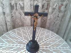 Old wooden cross in black with copper jesus pictures