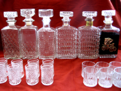 Elegant glasses and bottles for whiskeys, cognacs and drinks