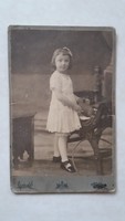 Antique children's photo gerber s. Photo of a little girl in a photographer's studio in Budapest