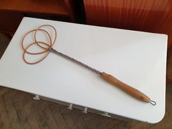 Old retro household appliance with wooden handle duster
