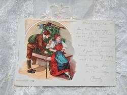 Antique art nouveau long-addressed litho postcard couple in folk costume, tile stove early piece 1899