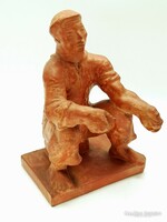Jenő Kerényi: snacking terracotta sculpture