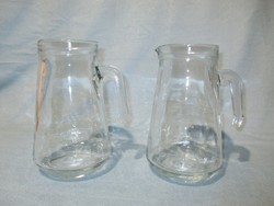 2 glass jugs and spouts