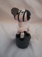 Wooden zebra toy with a retro tobacconist