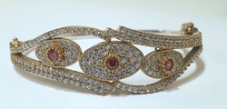 Silver-gilt (925) women's bracelet richly decorated with stones,