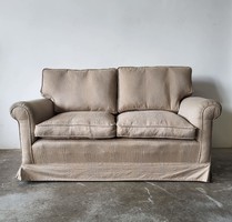 Two-person sofa - under the price! Now with a gift puff