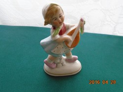 Antique German numbered porcelain girl singing on a mandolin