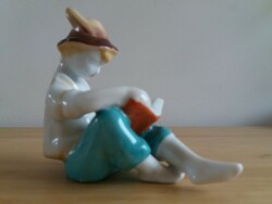 Ravenclaw porcelain figure, a boy in a reading hat