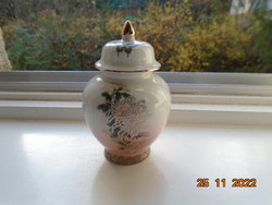 New decorative small Japanese vase with a lid, partly with pink glaze, gilded flower and butterfly patterns