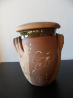 Brown ceramic salt shaker.