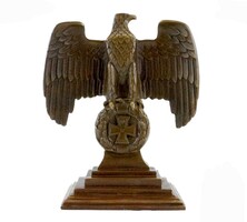 Bronze statue of an imperial eagle on an iron cross