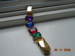 Vintage gilded cardigan or sweater clasp with colored stones in a gilded socket