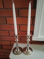 Silver colored metal candle holders for sale in pairs
