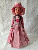 Old doll in a special outfit
