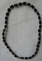 Black and white necklace with many small pearls