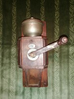 Antique, wall-mounted coffee grinder