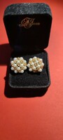 Women's earrings decorated with 14 carat gold, cultured salt water pearls. 1 pearl is missing.