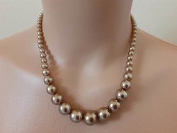 Golden brown, short tekla necklace made of growing beads