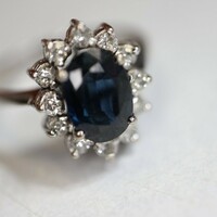 White gold ring with diamonds and sapphires. With proof