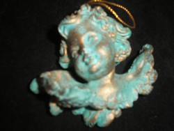 Gilded putto ornament on antique Christmas tree door