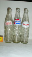 Three different retro Pepsi cola soda bottles - together