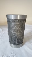 Tin cup decorated with figural patterns