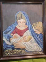 Tapestry picture made about 50 years ago. Mary with baby Jesus and an angel.