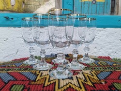 A wonderful set of hand-brushed glass glasses with gold rims