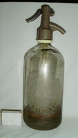 Old soda bottle with inscription 