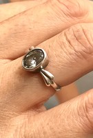 Beautiful silver ring with stones in a blue box at mom park! Just kp!