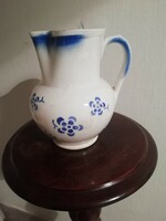 Old granite jug with floral pattern