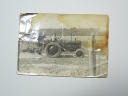 Old photo photo - tractor, plow man plowing agriculture ca. From the 1940s