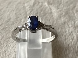 Modern, white gold ring with sapphire and tiny diamonds