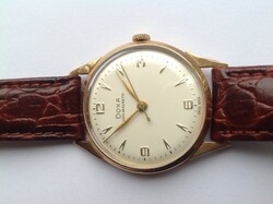 Gold doxa 14k gold men's watch, still in the more solid gold case, from the 1950s