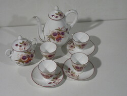 Coffee set with floral decor.