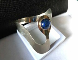 Modern bracelet with blue stones
