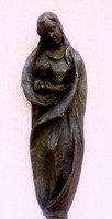 Wall-hung, bronze-coated, antiquated Madonna with her child. Rustic sculpture.